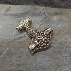 Bronze Goat Thors Hammer Pendant 10 Bronze Goat Thors Hammer Pendant -The Viking Dragon wl bronze large goat thors hammer on rock angle view
