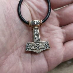 Bronze Odeshög Thors Hammer Pendant -The Viking Dragon wl bronze oseberg thors hammer on thong on hand
