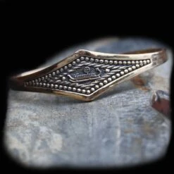 Viking Longship Bracelet -The Viking Dragon wl bronze viking hip bracelet on rock
