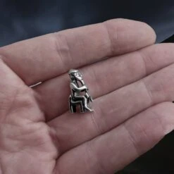 Silver Seated Thor Pendant 12 Silver Seated Thor Pendant -The Viking Dragon wl silver thor pendant on hand side view